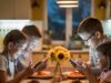 Addiction to the Technology Use: Symptoms and Treatment Children at dinner time ,lost in their phones ,not having meal