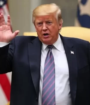 Trump Weighing U.S. Military Action Against Iran Amid Rising War Fears (1) Donald Trump with raised hands is talking, American flag in the background.