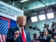 Trump’s Stern Warning to Iran Raises Political Alarms Worldwide Donald Trump addressing a press conference with a U.S. flag in the background and a banner that says Trump Warning to Iran Triggers Political Fears around the globe.